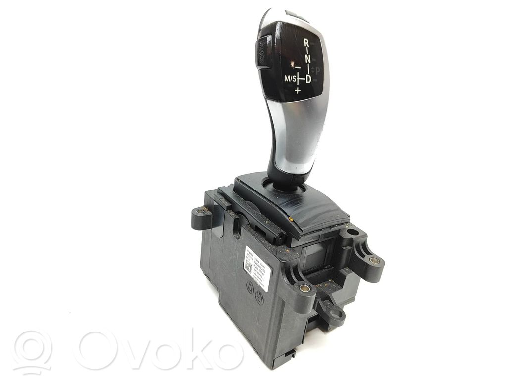 o-7591f9f54f510bb40c587bd54e2f1e43-bmw_5_f10_f11_pavaru_selektorius BMW 5 F10 F11 Sélecteur de vitesse 9239504 1002519200 – Image 1